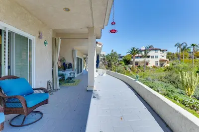 a porch of a house with chairs on it at 3 Mi to Beach Central and Elegant Home in Oceanside in Oceanside