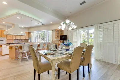 a kitchen and dining room with a table and chairs at 3 Mi to Beach Central and Elegant Home in Oceanside in Oceanside