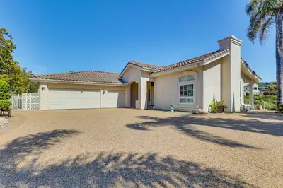a house with a large driveway in front of it at 3 Mi to Beach Central and Elegant Home in Oceanside in Oceanside
