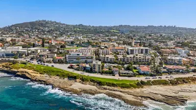 an aerial view of a beach with buildings and the ocean at Seize the Day in San Diego