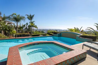 a swimming pool with a bricknergynergynergynergy at Pool Hot Tubs Views - Castillo de Windsor in San Diego