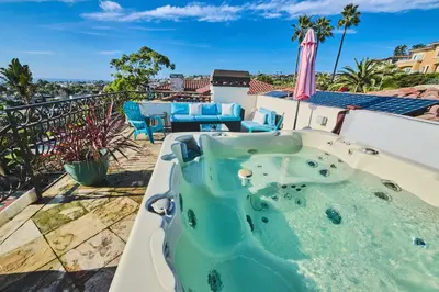 a hot tub on the roof of a house at Pool Hot Tubs Views - Castillo de Windsor in San Diego