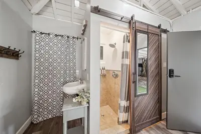 a bathroom with a shower and a sink at Bayside Getaway Waterfront in Newport Beach