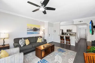 a living room with a couch and a ceiling fan at Newport Retreat A - Fab for 4 in Newport Beach