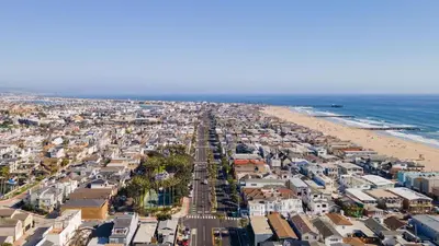 an aerial view of a city and the beach at Coastal-Chic Newport Stay Steps to the Beach Dining Boardwalk Optional Add-On Unit in Newport Beach