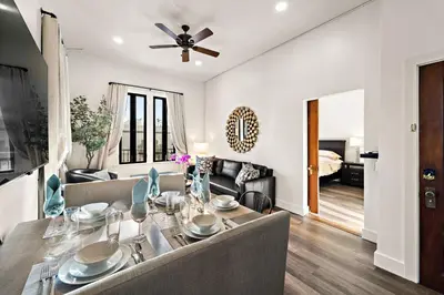 a dining room and living room with a dining table at The Artifact Hotel in San Diego