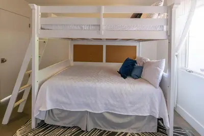 a bedroom with two bunk beds in a room at Scenic View Estate with Pool & Hot Tub in San Diego