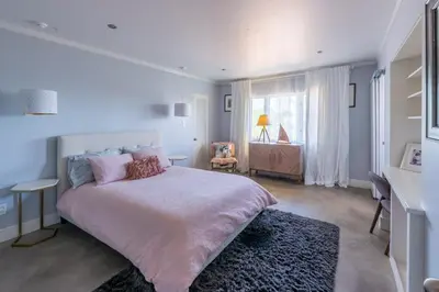 a bedroom with a large bed and a window at Scenic View Estate with Pool & Hot Tub in San Diego