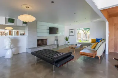 a living room with a couch and a fireplace at Scenic View Estate with Pool & Hot Tub in San Diego