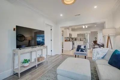 a living room with a couch and a table at Historic Barrio Logan Bungalow in San Diego