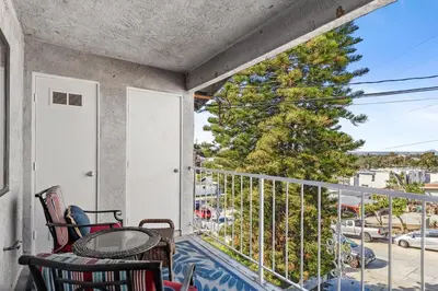 a balcony with a table and chairs and a view at Hidden Gem 3Bed 3Ba Retreat Jacuzzi AC Balconies in San Diego