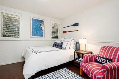 a white bedroom with a bed and a couch at La Jolla 3BR Oceanview Deck in San Diego