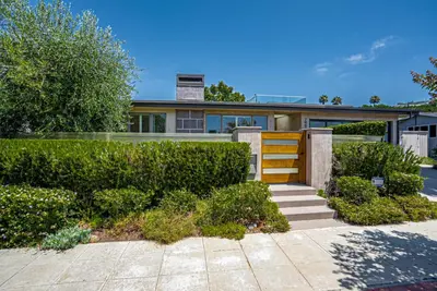 a house with a fence and some bushes at La Jolla 3BR Oceanview Deck in San Diego