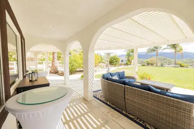 an outdoor room with a toilet and chairs and a patio at Temecula Wine Country Villa in Temecula