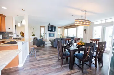 a kitchen and living room with a table and chairs at Temecula Wine Country Villa in Temecula