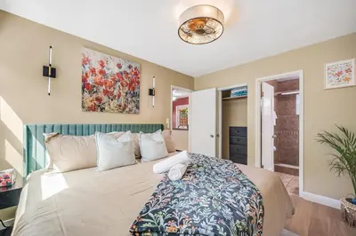 a bedroom with a large bed in a room at 1BD Heart of PB Pet Friendly Private Sanctuary in San Diego