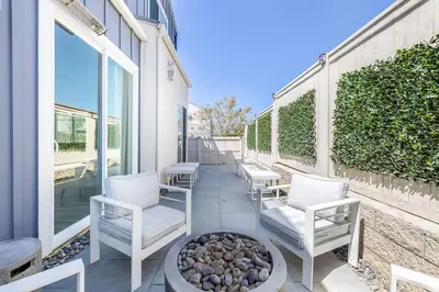 a patio with two chairs and a fire pit at Large 4 Bedroom Close To Beach in Encinitas