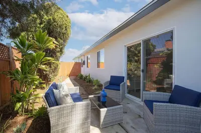 a patio with wicker chairs and a table at 4 Miles to Beach Central and Newly Renovated in San Diego
