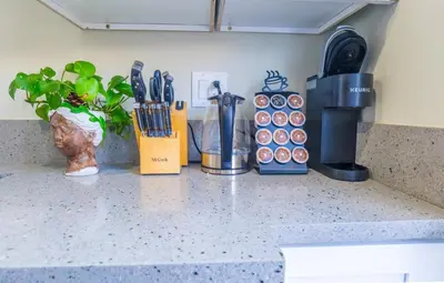 a counter top with utensils and a coffee maker at 2BR Retreat Near Balboa Park in San Diego