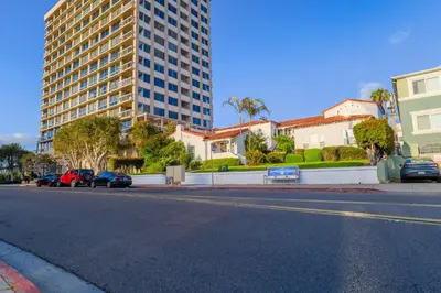a street with cars parked on the side of a building at 2BR Retreat Near Balboa Park in San Diego