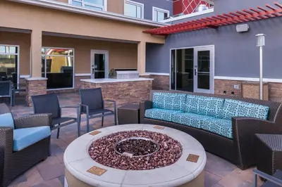 a patio with a couch and chairs and a fire pit at Residence Inn by Marriott Temecula Murrieta in Murrieta