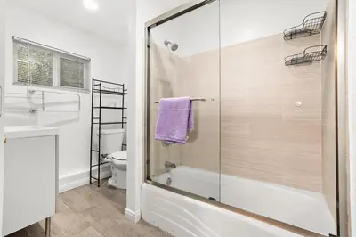 a bathroom with a shower and a sink and a toilet at Entire Private Home with 4 Bedrooms 3 Bathrooms, King Bed, Big Yard, Prime Area, Ranch Style, Available Now in La Mesa