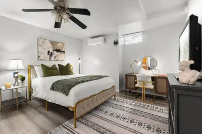 a bedroom with a bed and a ceiling fan at Entire Private Home with 4 Bedrooms 3 Bathrooms, King Bed, Big Yard, Prime Area, Ranch Style, Available Now in La Mesa