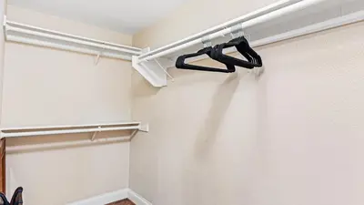 a walk in closet with a black hanger at Close to Beach w Patio Resort Amenities The Point at Corniche by AvantStay STR16-0458 in Dana Point