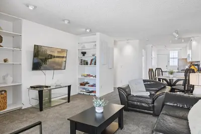 a living room with a couch and a table at Shoreline Hideaway in San Diego