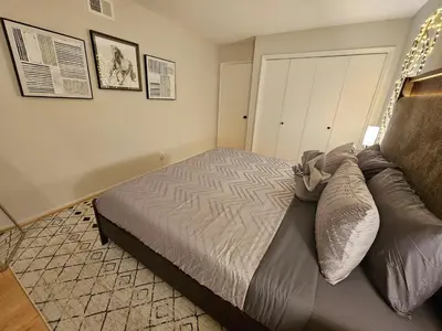 a bedroom with a large bed in a room at La Jolla Gem with Ocean View - 11 Beds, Hot Tub, Karaoke & Game Den in San Diego