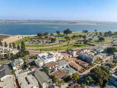 an aerial view of a city with houses and the water at BoHo Beach House Walk to the Sand in San Diego