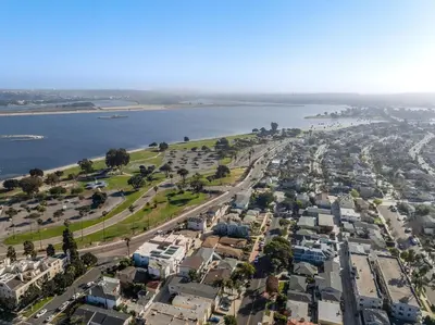 an aerial view of a city with a river and houses at BoHo Beach House Walk to the Sand in San Diego