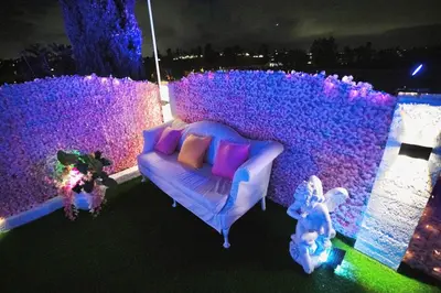 a room with a couch and a wall with purple lights at Casa de Bloom Venue - Your Perfect Event Space in San Diego