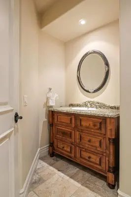 a bathroom with a sink and a mirror at 7BR Carlsbad Estate with Pool Firepit & Views in Carlsbad