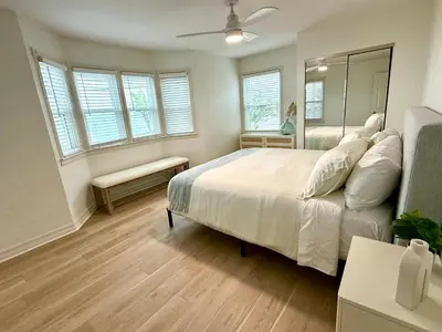 a bedroom with a large bed and a mirror at F-73 Terramar Cliffs in Carlsbad