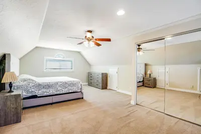a bedroom with a bed and a ceiling fan at F-76 Terramar Cliffs in Carlsbad