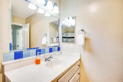 a bathroom with a sink and a mirror at F-76 Terramar Cliffs in Carlsbad