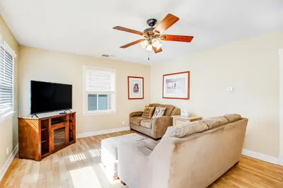 a living room with a couch and a flat screen tv at F-76 Terramar Cliffs in Carlsbad
