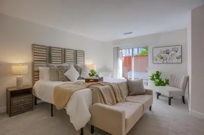 a bedroom with a large bed and a couch at F-78 Seaside Escape in Encinitas