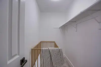 a staircase in a white room with a towel on it at F-78 Seaside Escape in Encinitas