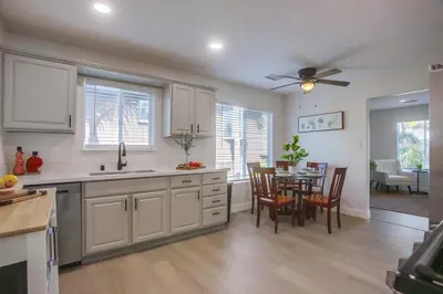 a kitchen and dining room with a table and chairs at F-78 Seaside Escape in Encinitas