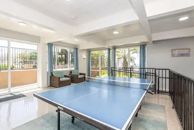 a large room with a ping pong table in it at Steps to the Beach 2 Pools & Hot Tubs - A-204 in Oceanside