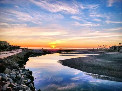 a view of a river with the sunset in the background at Penthouse Ocean & Sunset Balcony Views - G-323 in Oceanside