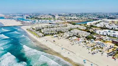 an aerial view of a beach with buildings and the ocean at Penthouse Ocean & Sunset Balcony Views - G-323 in Oceanside