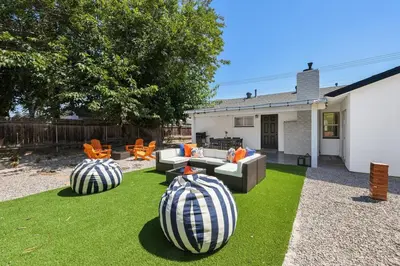 two large watermelons sitting on the grass in a yard at Luxury Home with Spacious Backyard - Sleeps 12 in Poway