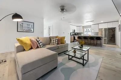 a living room with a couch and a table at Luxury Home with Spacious Backyard - Sleeps 12 in Poway