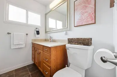 a bathroom with a toilet and a sink at 10 Mins to the Beach La Jolla and UCSD in San Diego