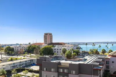 a view of a city with the ocean in the background at Upscale Modern Spacious Loft in Little Italy in San Diego