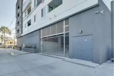 a building with a large door on the side of it at Lux North Park Gem King Beds Workspaces Parking in San Diego