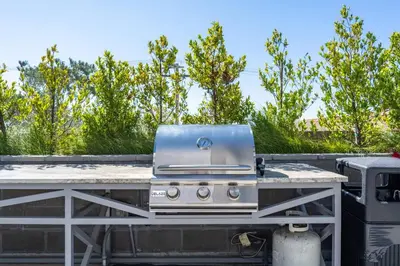a grill on the back of a trailer at Lux N Park Penthouse King Beds Workspaces Parking in San Diego